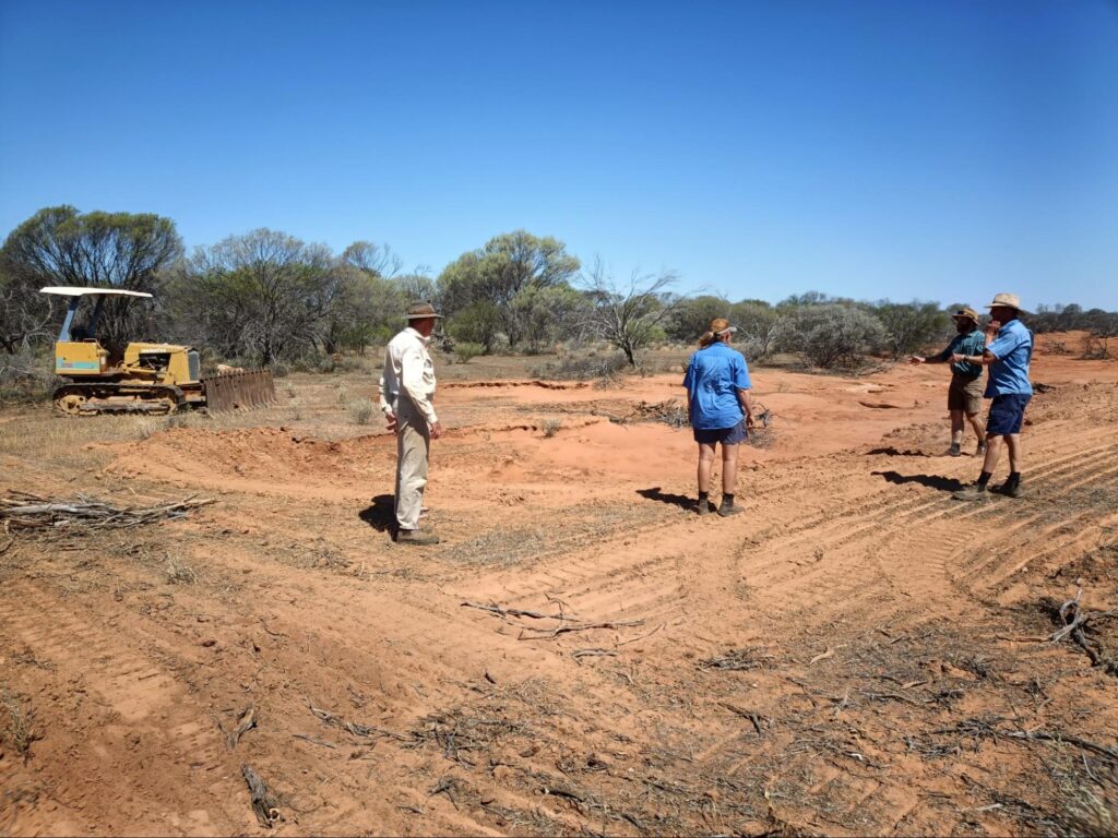 Neighbouring station owners and Ken inspecting erosion repairs on a gully at Melangata Station.. Source: Jo Clews.